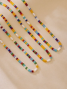 Close-up of colorful crystal beads and pearls on a handmade bohemian necklace