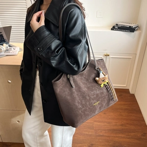 Retro brown oversized tote bag with gold lettering and plush bear charm for women