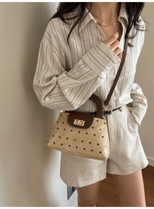 French retro style beige polka dot handbag with brown flap and golden metal clasp