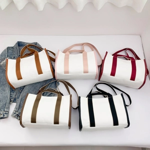 Minimalist large canvas tote bags in five colors with adjustable shoulder straps