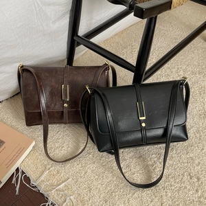 Retro minimalist square shoulder bags in black and dark brown with golden hardware detail