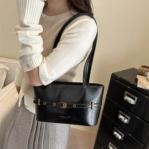 Chic black underarm tote bag with gold buckle strap for stylish daily commuting wear