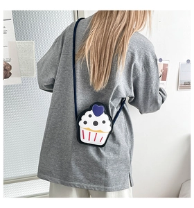 Cute cupcake shaped shoulder bag for girls shown on model to demonstrate size and fit