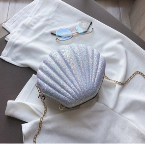 Close-up of glitter shell crossbody bag with iridescent purple finish and chain strap