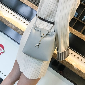 Women's light blue mini crossbody bucket bag with deer charm and drawstring closure