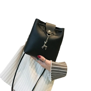 Mini black leather bucket bag for women with silver deer pendant and drawstring closure