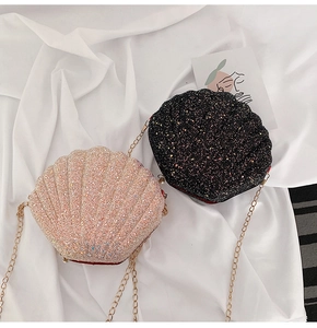 Detailed view of glitter shell-shaped crossbody bags with elegant gold chain straps