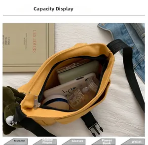 Top view of yellow canvas messenger bag showing large capacity for daily essentials