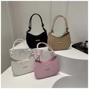 Minimalist half-moon underarm bags with knotted handles in black, beige, white, and pink