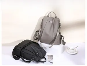 Detailed view of gray and black waterproof nylon backpacks for urban daily commuting