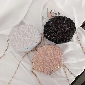 Glittery shell-shaped chain crossbody bags in silver, black and rose gold colors
