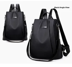 Detail view of durable black waterproof nylon backpack with metal zippers and straps
