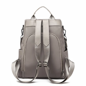 Waterproof light grey nylon backpack with adjustable straps and anti-theft back pocket