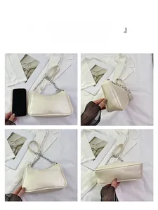 Detail shots of off-white leather underarm bag with elegant pearl strap and silver chain