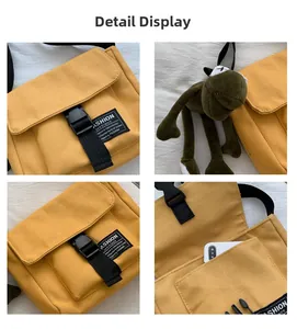 Detail view of yellow canvas crossbody bag featuring adjustable straps and buckle
