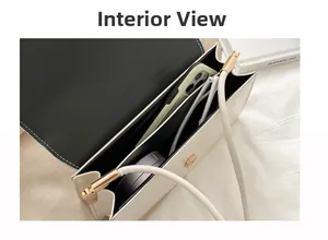 Detailed view of white crocodile pattern bag interior showing spacious storage capacity
