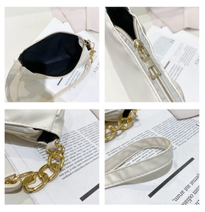 Detail shots of off-white PU leather shoulder bag with gold chain and zip closure
