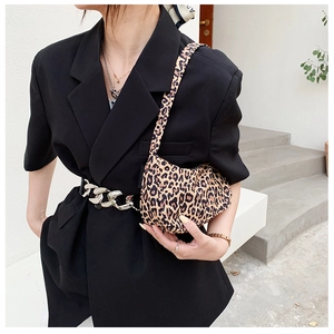 Chic leopard print canvas shoulder bag styled with a minimalist black blazer