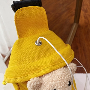 Cute yellow canvas crossbody bag with a plush bear and integrated metal earphone port