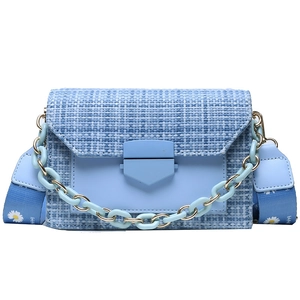 Light blue tweed crossbody bag with acrylic chain and daisy print wide strap