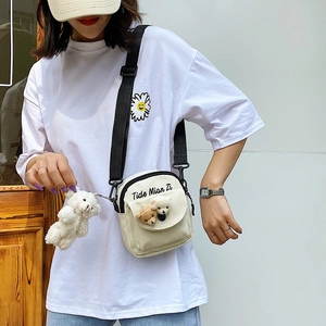 Japanese style white canvas crossbody bag with teddy bear charm and cute embroidery
