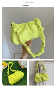 Detailed view of neon green pleated cloud bag with scrunchie style shoulder strap
