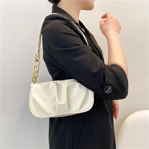 Cream pleated underarm shoulder bag with chunky gold chain strap for women