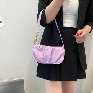 Lavender pleated shoulder bag with gold chain strap for women shown on model