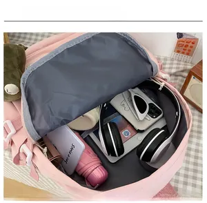 Macro view of spacious pink backpack interior showing storage for tablet and electronics