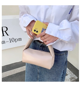 Chic beige cylindrical handbag with smooth PU leather texture for casual daily styling