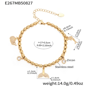 Detail of stainless steel bead bracelet with zircon dolphin and whale tail charms