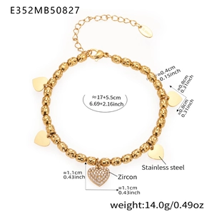 Detail view of a gold heart charm bracelet with dimensions and weight measurements