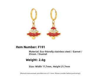 Detail of Christmas tree earrings with red enamel, garnets and cubic zirconia accents