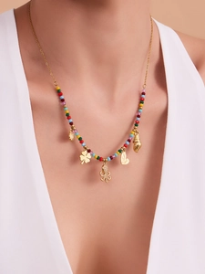 Close-up of ocean-style octopus and shell charms on a colorful beaded necklace