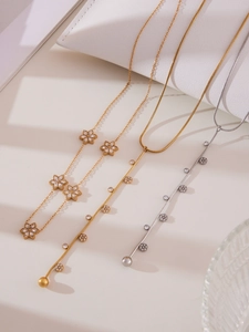 Detailed view of 5A zircon flower necklace and Y-shaped tassel necklaces in gold and silver