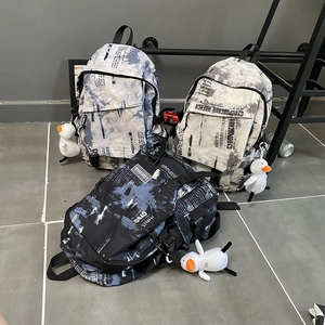 Sacs à dos scolaires LQIUSHA grande capacité avec motifs tie-dye et journal et porte-clés canard