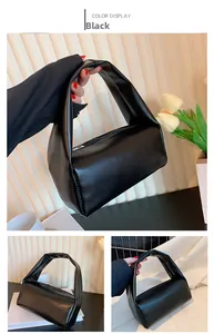 Minimalist black PU leather cylindrical handbag with metal zipper and single top handle