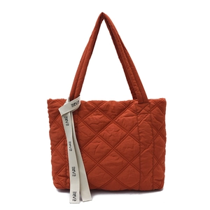 Quilted caramel cotton tote bag with diamond stitching and branded ribbon strap