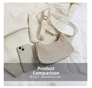Straw half-moon crossbody bag shown next to a smartphone for size comparison