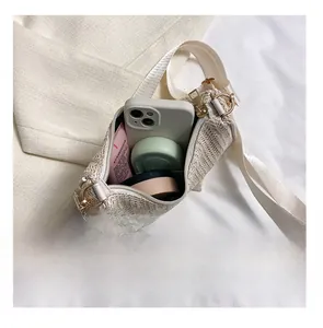 Detail presentation of straw woven tote bag capacity with zipper closure and strap