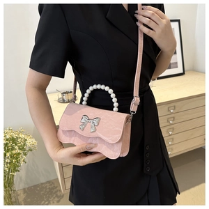 Pink marble pattern crossbody bag with pearl handle and silver bow detail for women