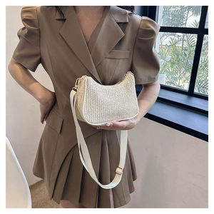 Chic woven half-moon straw tote bag with contrast piping and adjustable wide shoulder strap