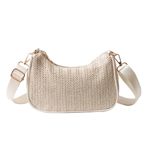 Chic cream straw tote bag with half-moon woven design and adjustable shoulder strap