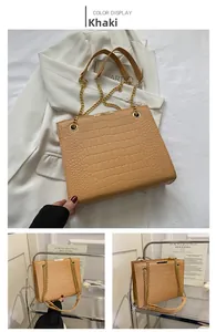 Dettaglio borsa tote kaki motivo coccodrillo con catena d'oro e barra metallica