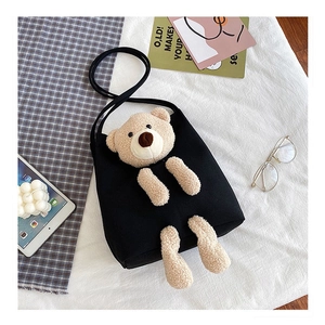 Black canvas shoulder bag with 3D teddy bear plush doll in high-capacity Korean style