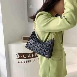 Quilted black leather crescent shoulder bag with chunky gold chain strap for women