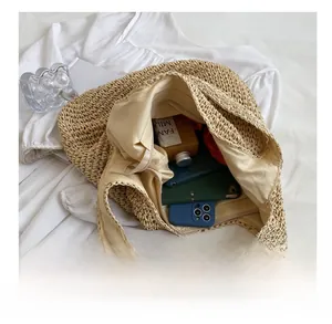 Top view of hand-woven shoulder bag with lining and large capacity storage details