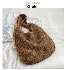 Top view of a khaki woven bucket bag with detailed rope texture and a matching strap