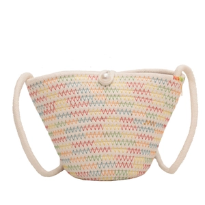 French woven bucket bag with colorful stitching and a decorative pearl button closure
