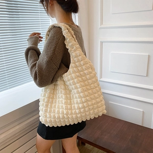Minimalist off-white popcorn texture shoulder bag shown with high-quality soft material
